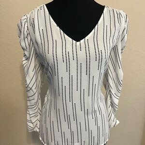 CAbi Black and White Fitted Blouse with V-Neck and Ruched Sleeves